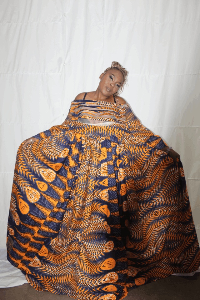 One of Outreach Foundation's sewing students shows off the incredible sewing skills she learnt 