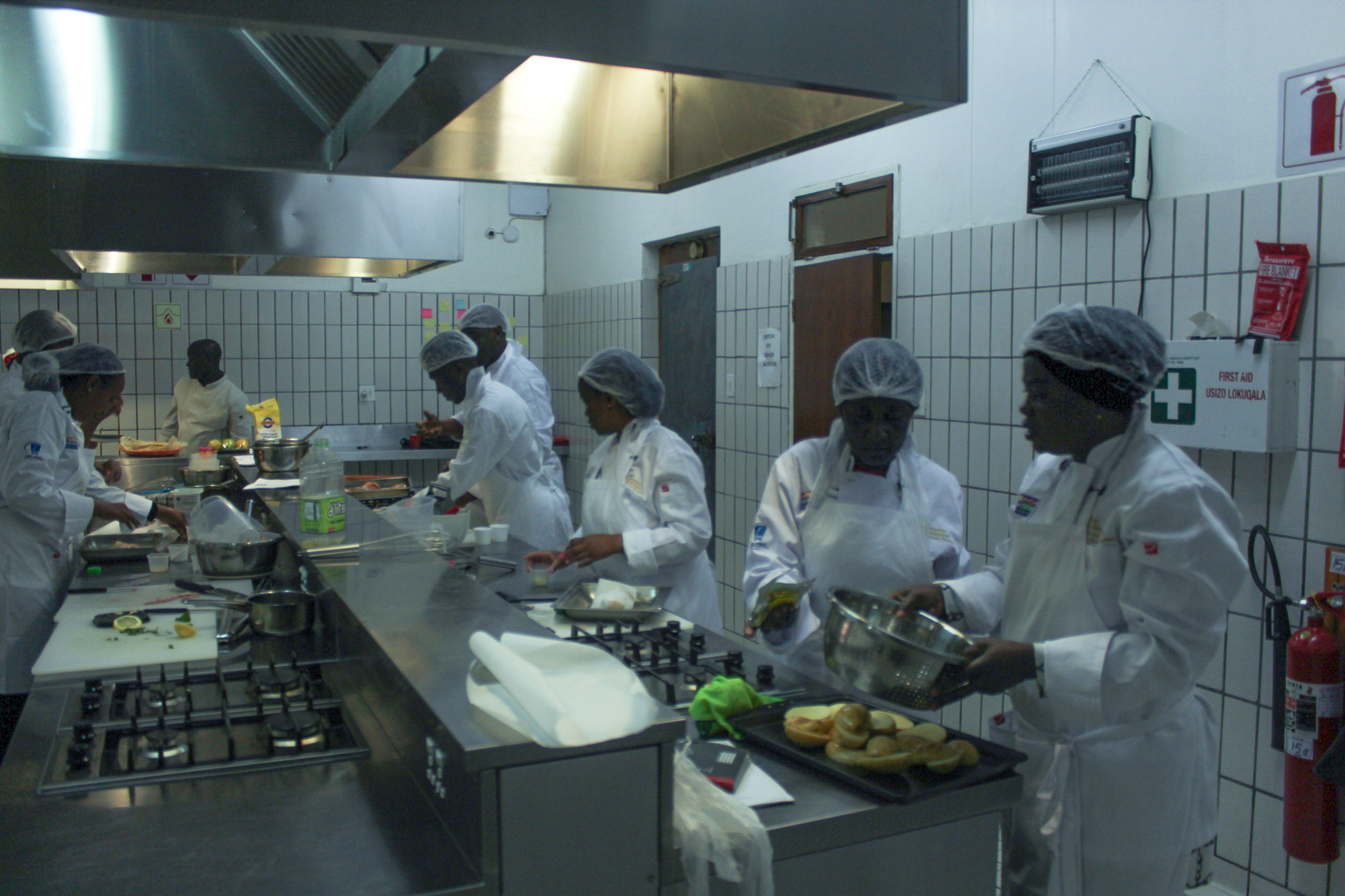 Students busy in the Outreach Foundation teaching kitchen learning valuable cooking skills